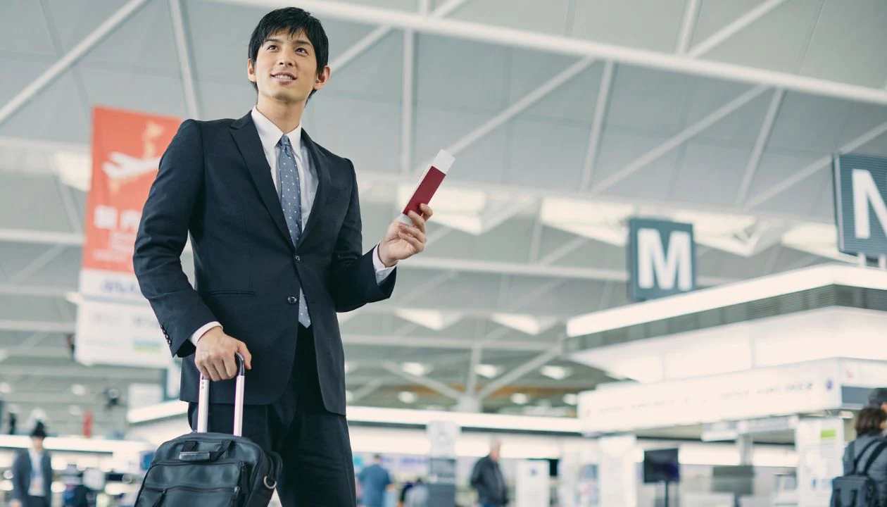 Moving abroad luggage checklist with packed suitcase and travel essentials