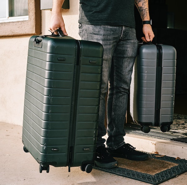 Doorstep extra baggage pickup service collecting travel suitcase from home for airport delivery